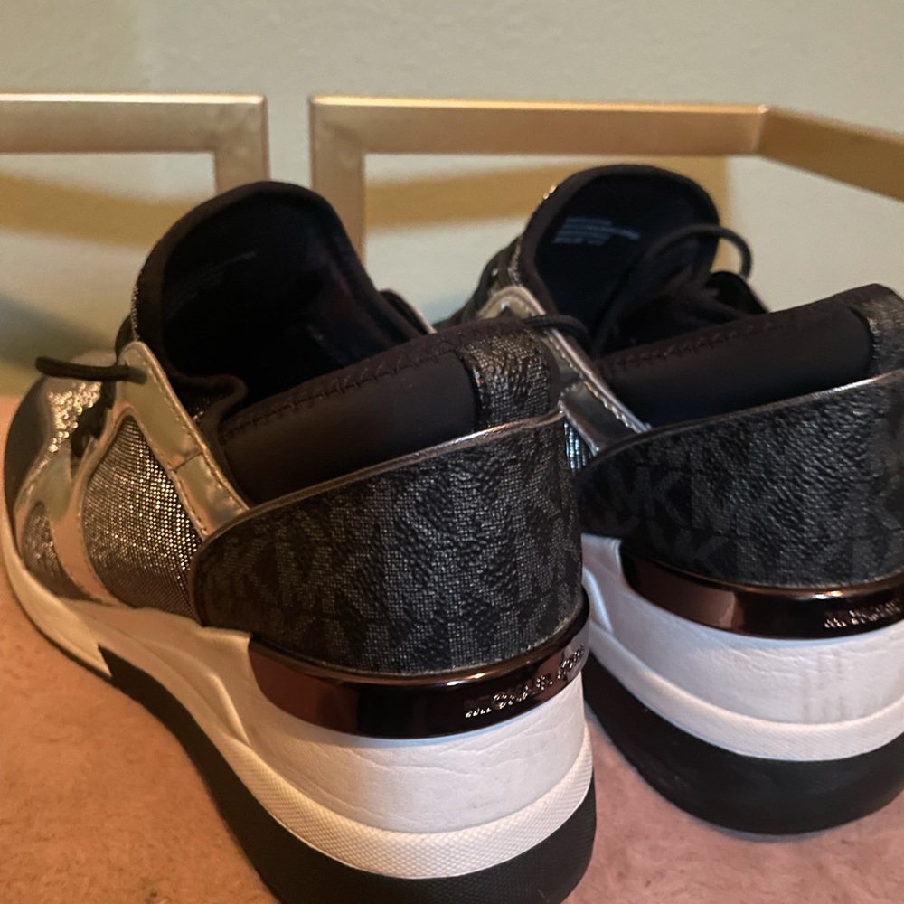 Silver sparkle and black MK wedge trainers